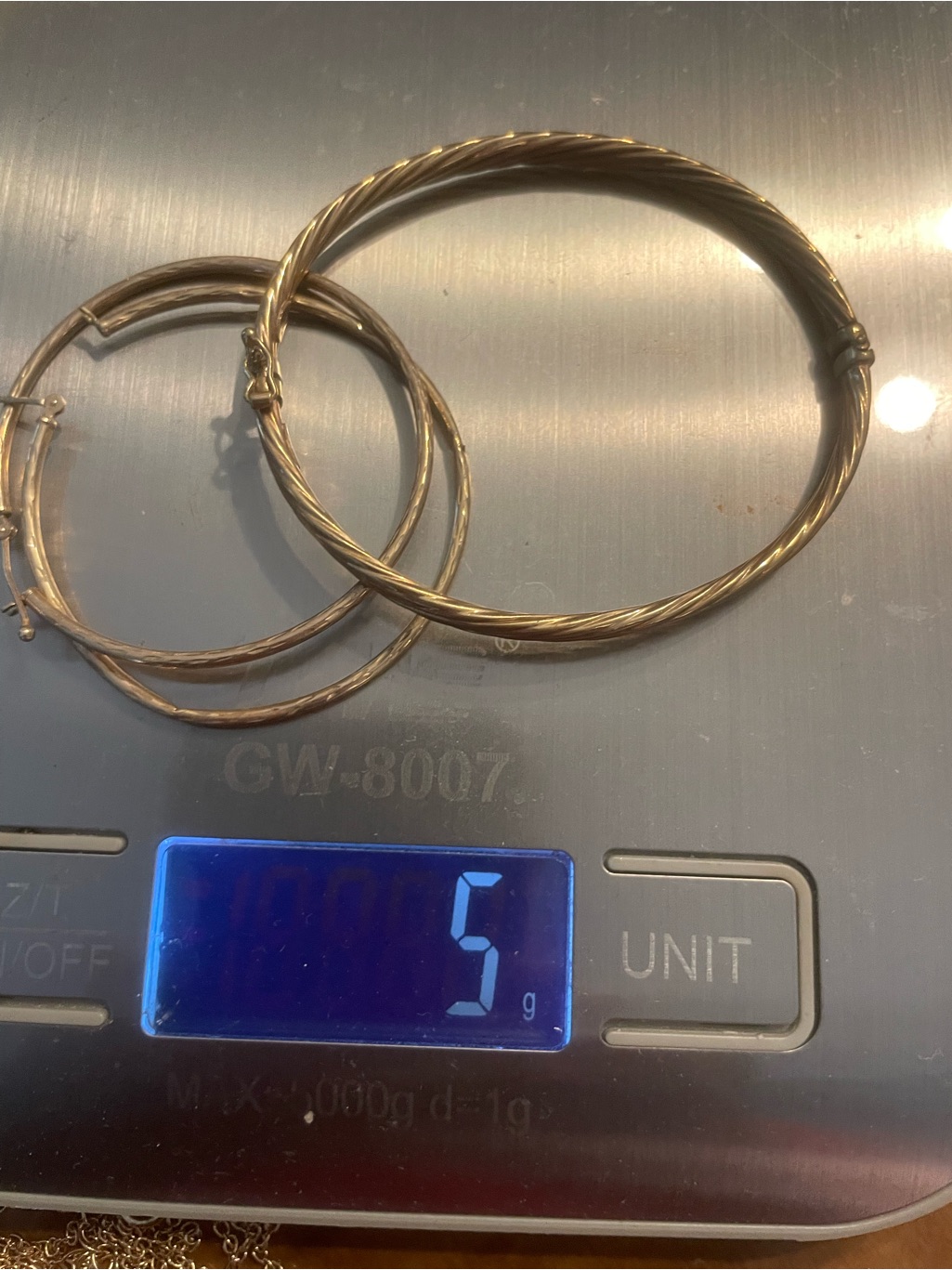 5 Grams 14 Kt Gold Earrings & 14 Kt Gold Swirl Bracelet.